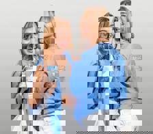 Two women wearing the blue Happy V Crewneck Sweatshirt