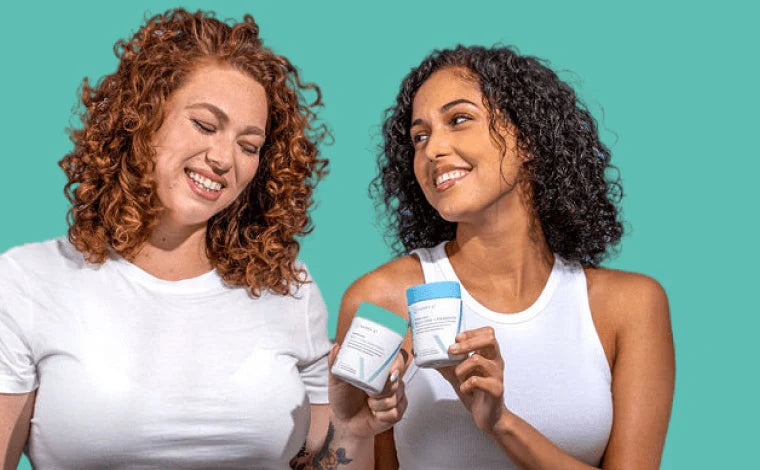 Two women holding Happy V products in their hands desktop.