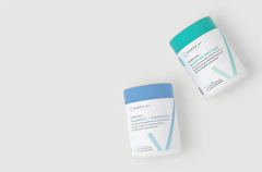 Happy V products on a grey background.